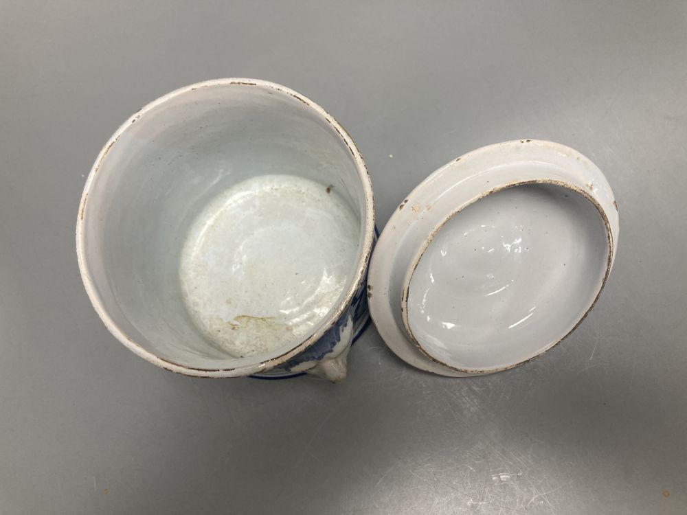 An 18th/19th century Delft blue and white jar and cover, with bearded mask handles, 17cm